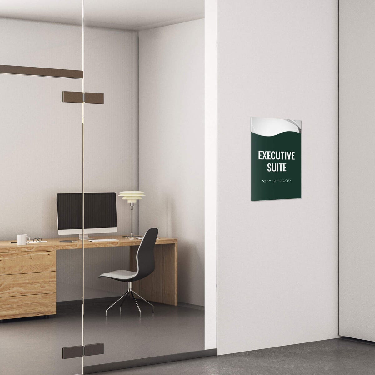 A 2-layer ADA sign for an executive suite with a green foreground and the basic swoop background