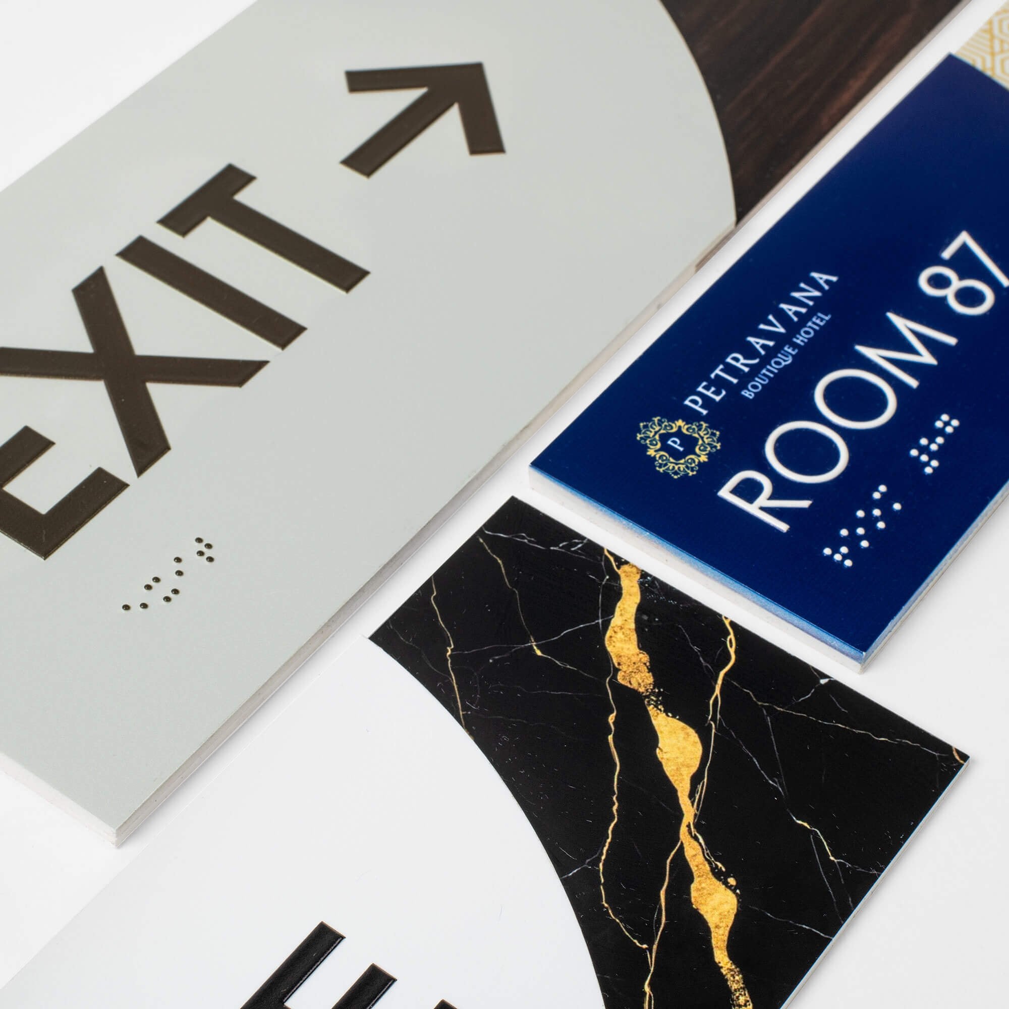 Three different 2-layer ADA sign designs next to each other to show various pattern combinations Three different 2-layer ADA sign designs next to each other to show various pattern combinations