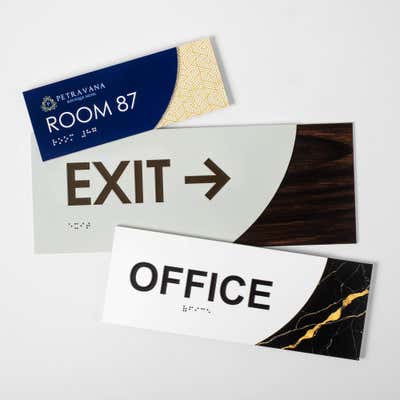 Three different sizes of the modern sleek 2-layer ADA sign next to each other