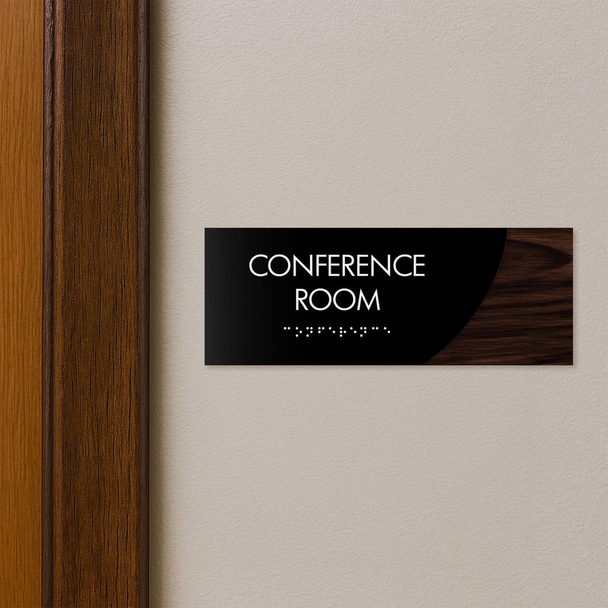 A 2-layer ADA sign for a conference room with a black foreground and a dark woodgrain background