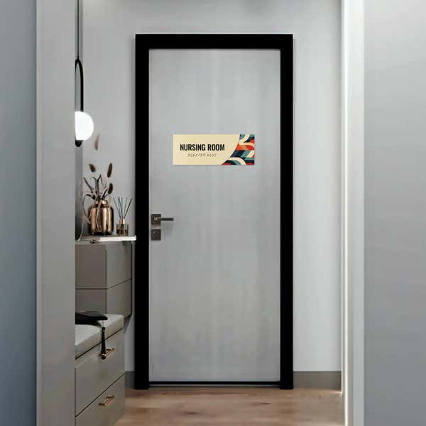 The modern layered ADA sign for a restroom with an ivory foreground and multi geometric background