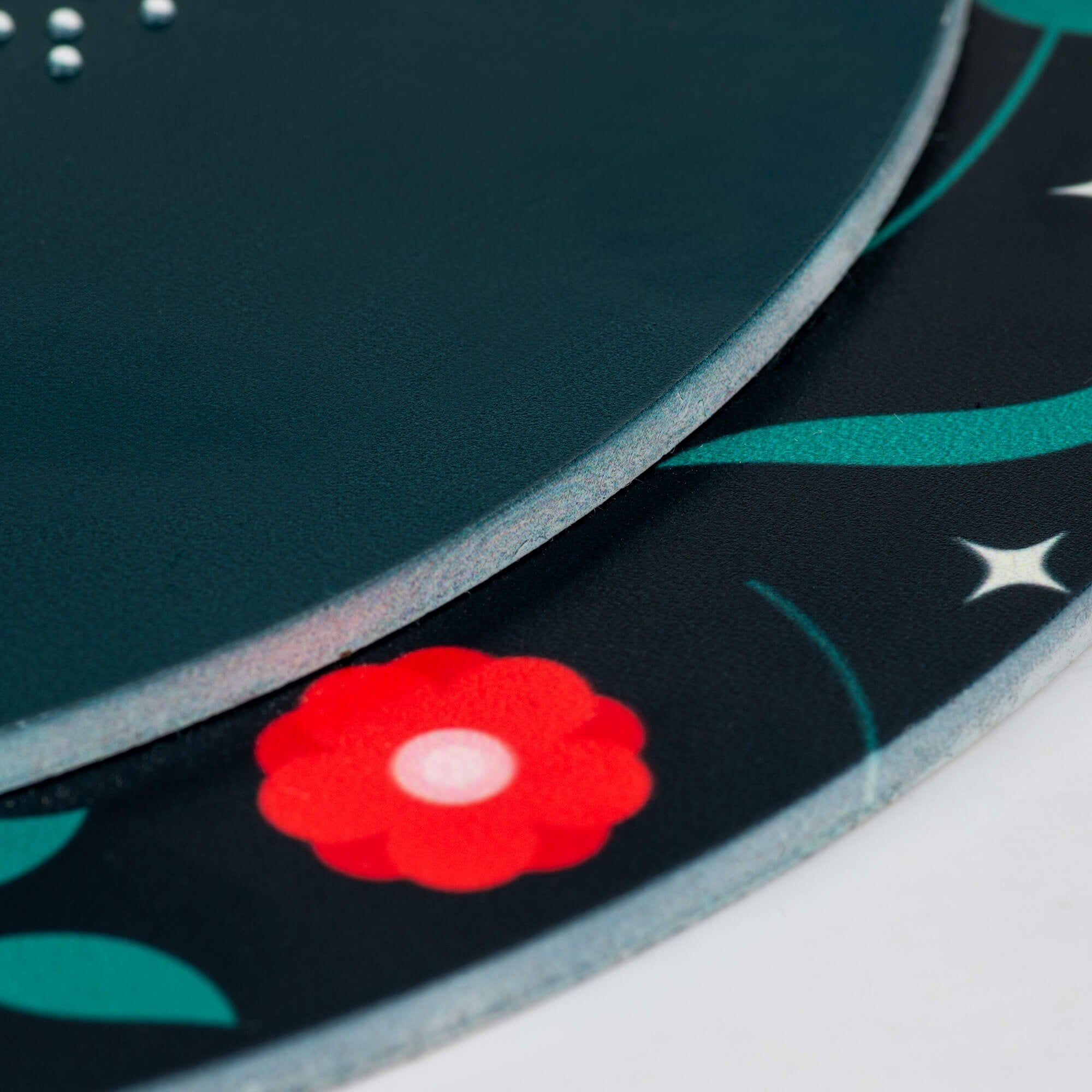 A close-up on the two layers of the round ADA sign A close-up on the two layers of the round ADA sign