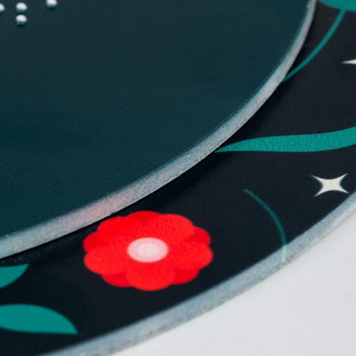 A close-up on the two layers of the round ADA sign