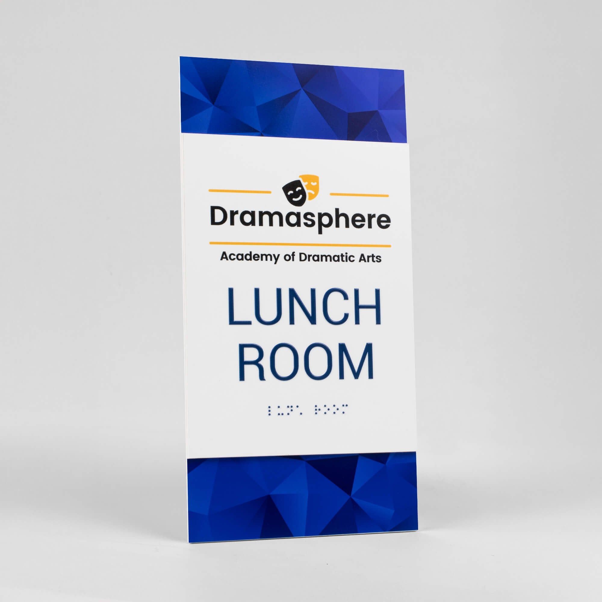 A design example of the 2-layer ADA sign for a lunchroom with the school name and logo above the text