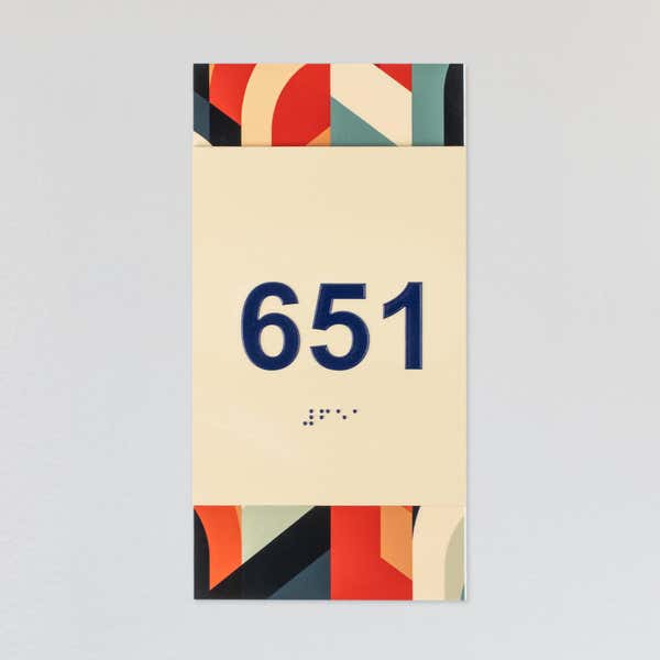 A design example of the 2-layer ADA sign with an ivory foreground and the multi geometric background