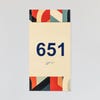 A design example of the 2-layer ADA sign with an ivory foreground and the multi geometric background