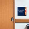 A layered ADA sign for a storage closet with a blue foreground and multi geometric background