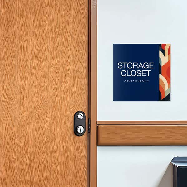 A layered ADA sign for a storage closet with a blue foreground and multi geometric background