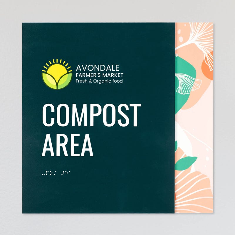 An example of a layered ADA sign design for a compost area with a green foreground and an orange floral background