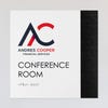 An example of a layered ADA sign design for a conference room with a white foreground and black geometric background