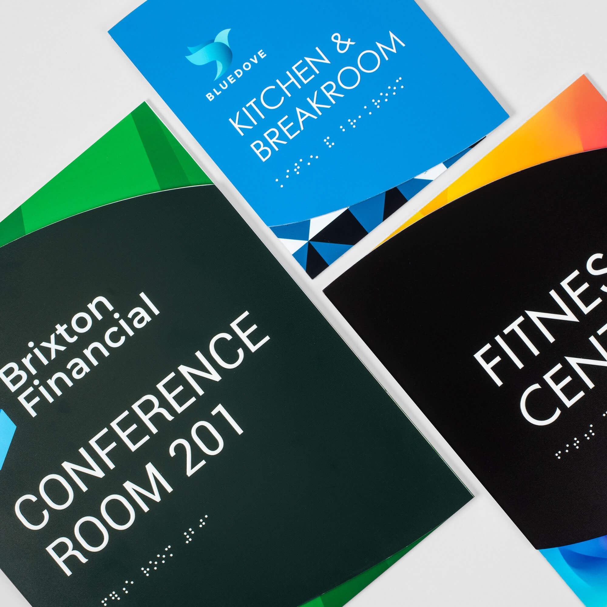 Various sizes of the modern twist ADA sign displayed next to each other