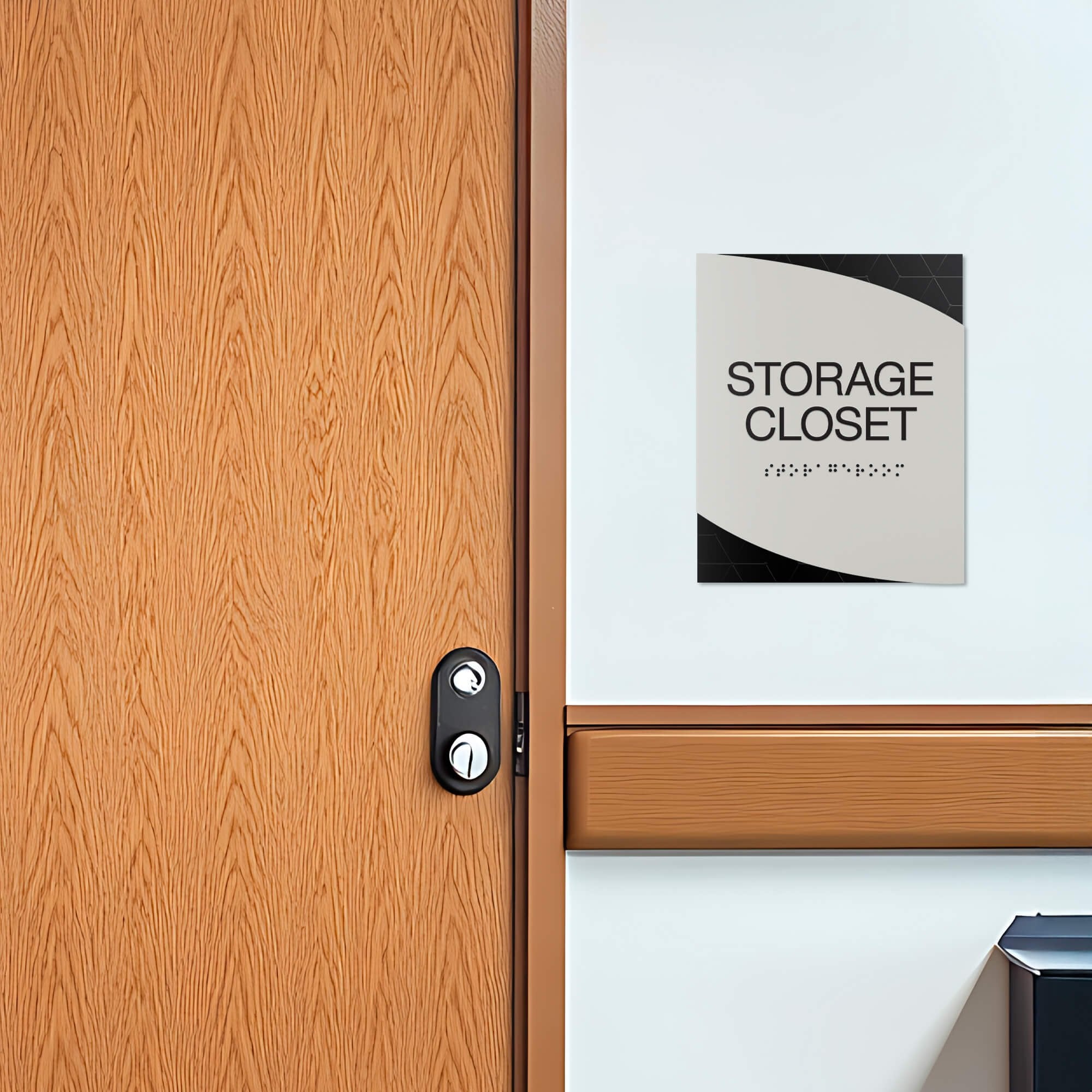 A modern twist design ADA sign for a storage closet with the black geometric background and gray foreground