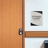 A modern twist design ADA sign for a storage closet with the black geometric background and gray foreground