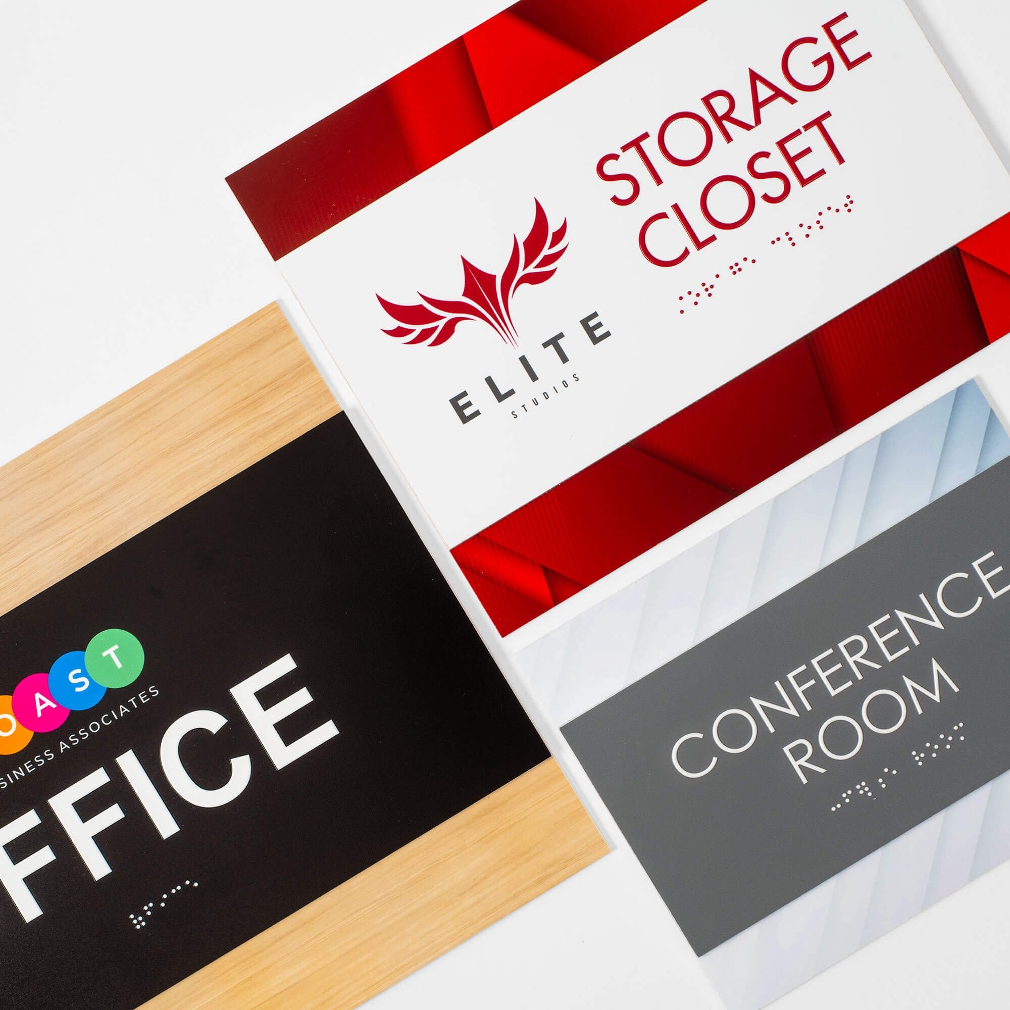 Three different 2-layered ADA sign examples lie next to each other to show various color combinations Three different 2-layered ADA sign examples lie next to each other to show various color combinations