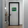 A 2-layered ADA sign for an office with a green foreground and green gradient background