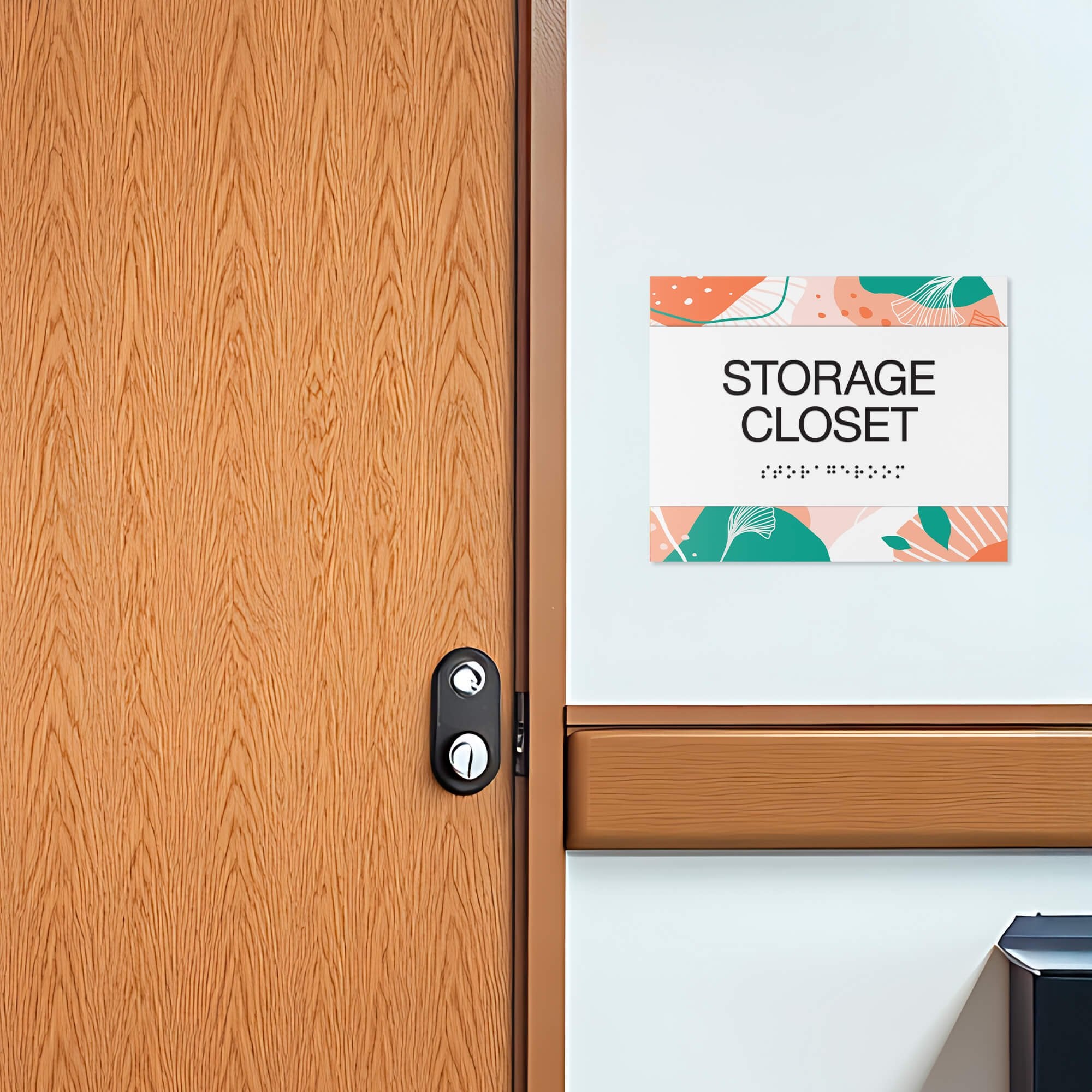 The horizontal 2-layer ADA sign for a storage closet with a white foreground and orange floral background The horizontal 2-layer ADA sign for a storage closet with a white foreground and orange floral background