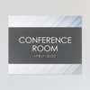 A design example of the horizontal 2-layer ADA sign for a conference room with a gray foreground and minimal diagonal background