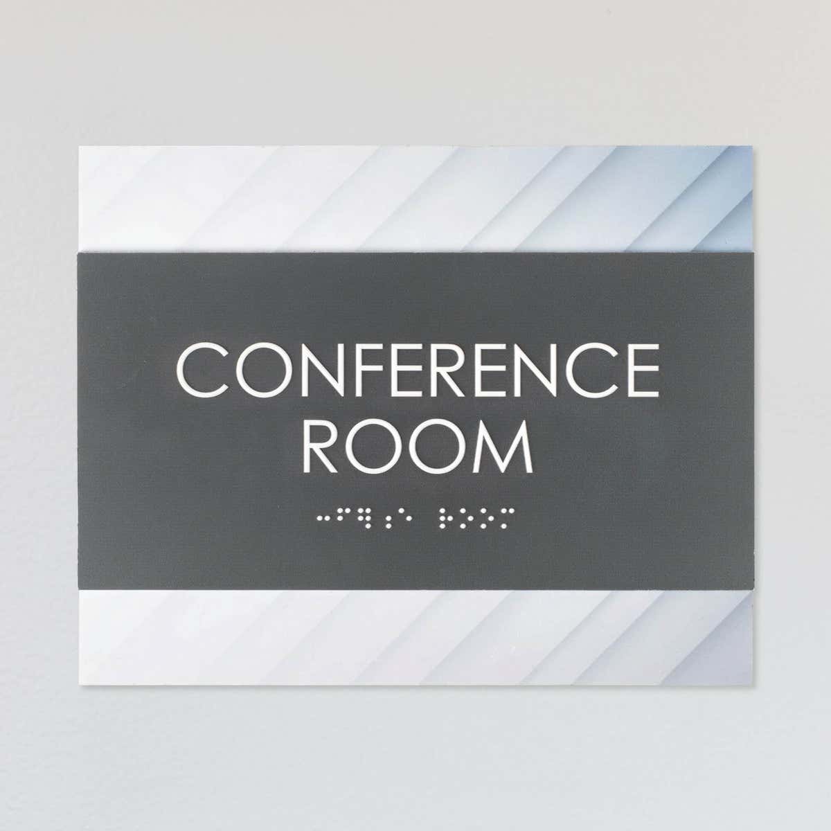 A design example of the horizontal 2-layer ADA sign for a conference room with a gray foreground and minimal diagonal background