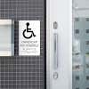 A white ADA sign for a handicap accessible entrance