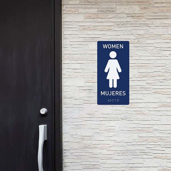 Custom ADA sign for a women's restroom with English and Spanish writing