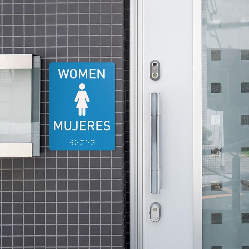 Custom ADA sign for a women's restroom with English and Spanish text