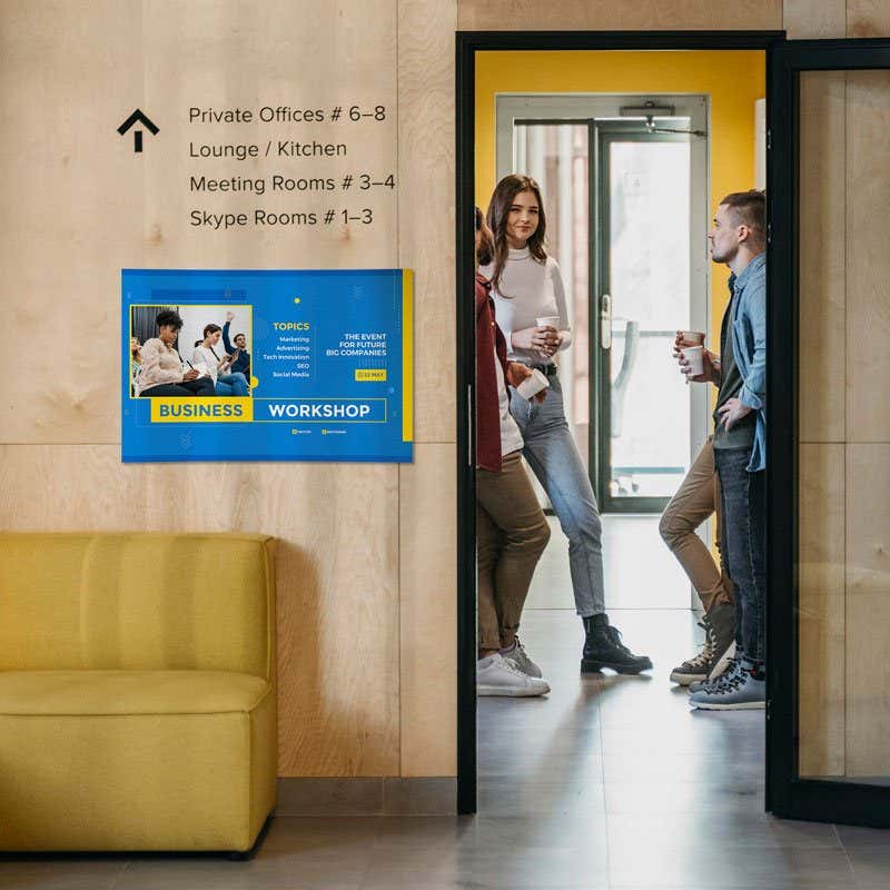 Blue and yellow custom sign with bold business event design, mounted on a wall in a modern office lobbyBlue and yellow custom sign with bold business event design, mounted on a wall in a modern office lobby