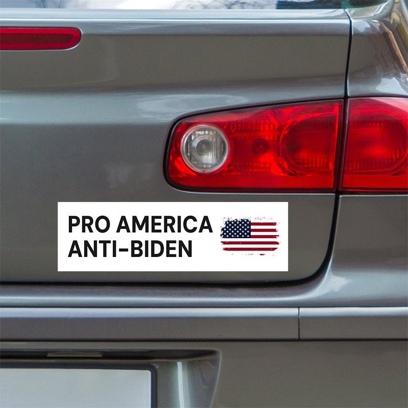 Pro America Anti-Biden bumper sticker below a gray car's tail light