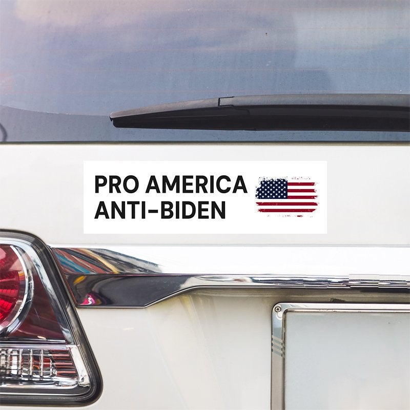 Pro America Anti-Biden bumper sticker above a white car's tail light