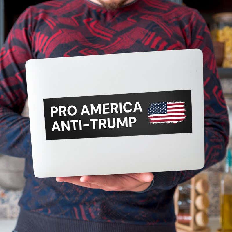 Pro America Anti Trump bumper sticker on a laptop