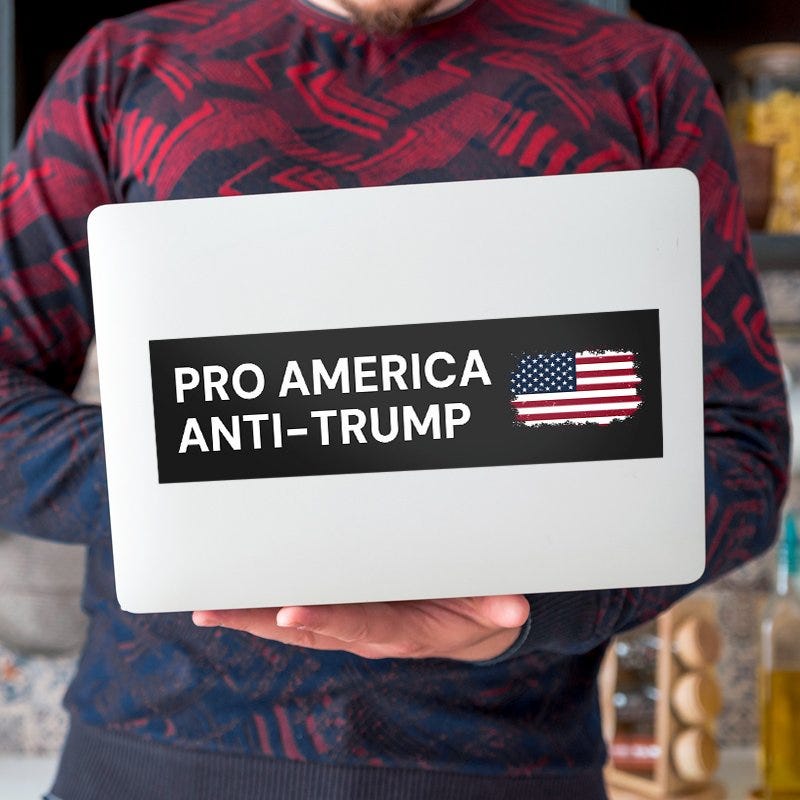 Pro America Anti Trump bumper sticker on a laptop