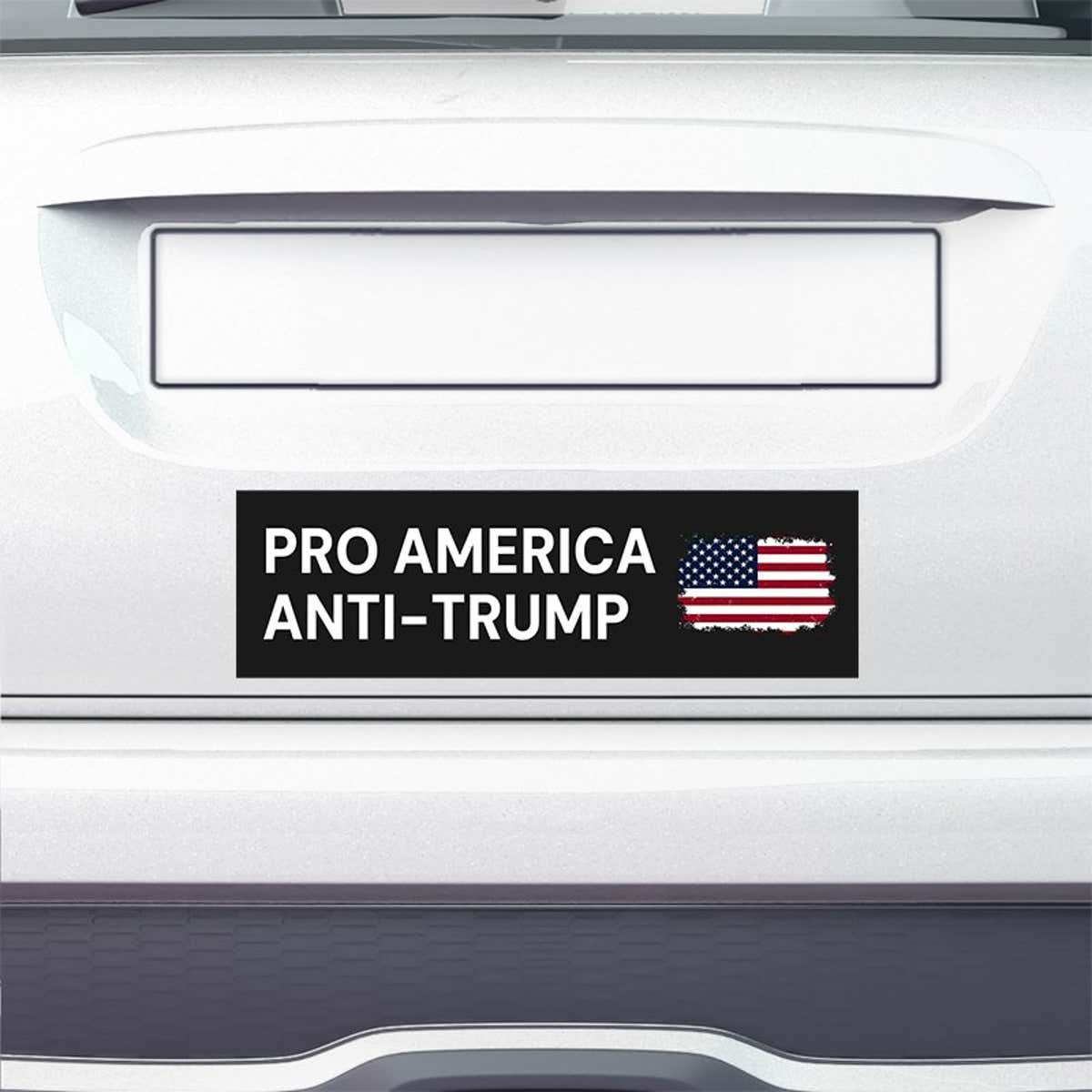 Pro America Anti Trump bumper sticker on the bumper of a white car