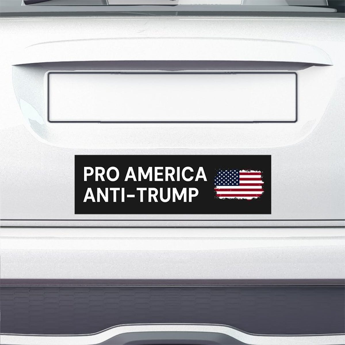 Pro America Anti Trump bumper sticker on the bumper of a white car