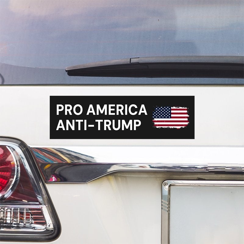Pro America Anti Trump bumper sticker above a white car's tail light