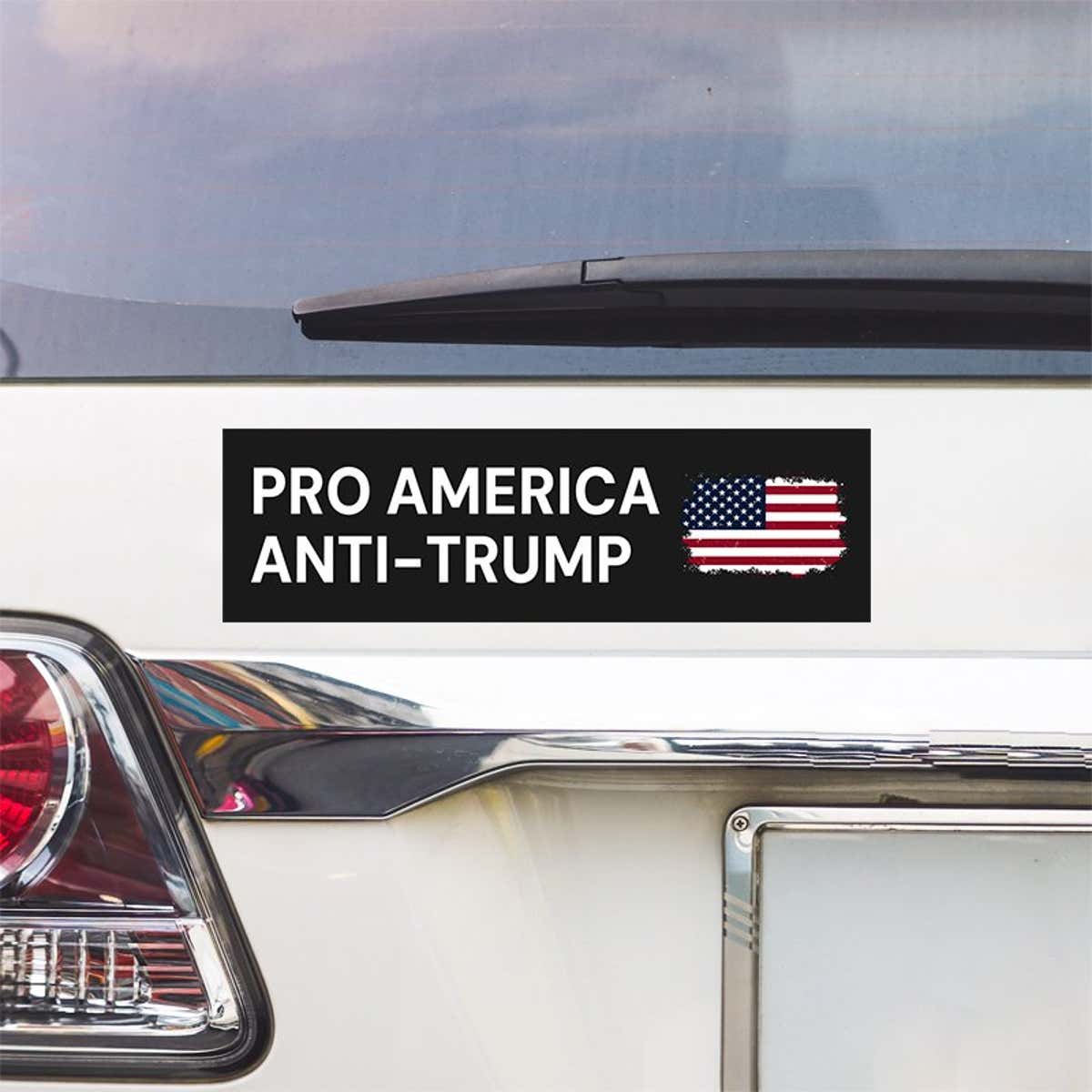Pro America Anti Trump bumper sticker above a white car's tail light