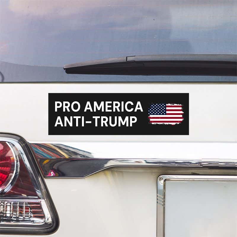 Pro America Anti Trump bumper sticker above a white car's tail light
