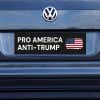 Pro America Anti Trump bumper sticker on a gray car