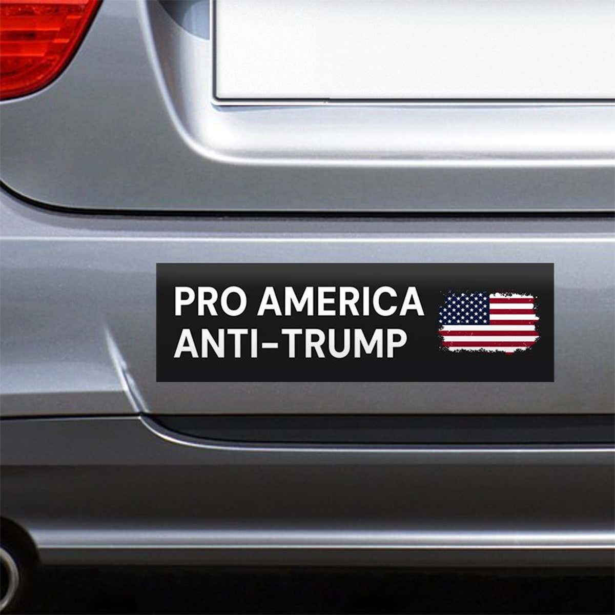 Pro America Anti Trump bumper sticker on the bumper of a gray car