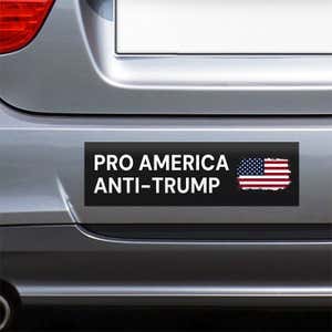 Pro America Anti Trump bumper sticker on the bumper of a gray car