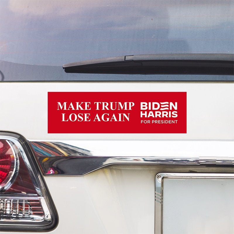 Make Trump Lose Bumper Sticker above a white car's tail light