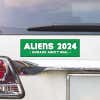 Aliens - Humans Aren't Real Bumper Sticker above a white car's tail light