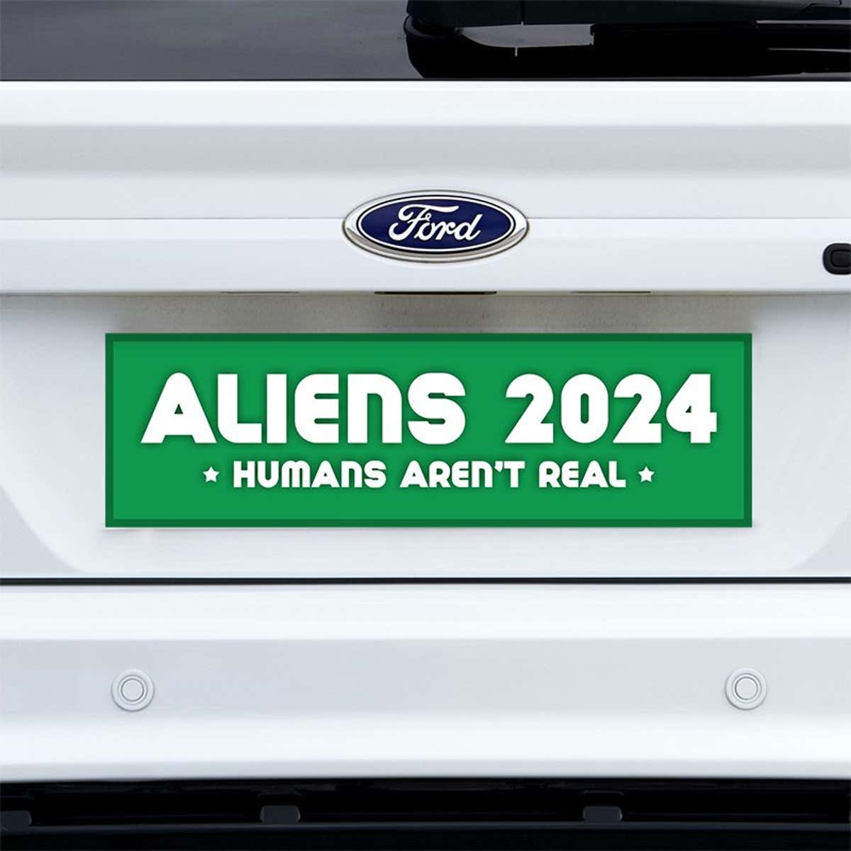 Aliens - Humans Aren't Real Bumper Sticker on a white truck