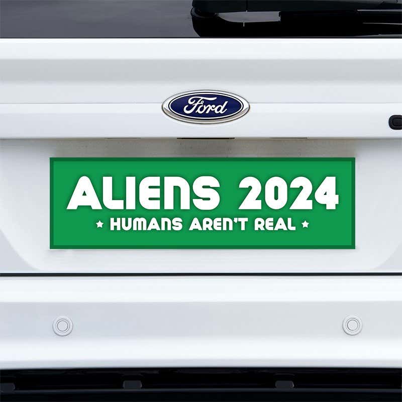 Aliens - Humans Aren't Real Bumper Sticker on a white truck