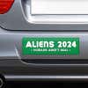 Aliens - Humans Aren't Real Bumper Sticker on the bumper of a gray car