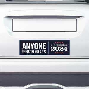 Anyone Under 70 bumper sticker on the bumper of a white car