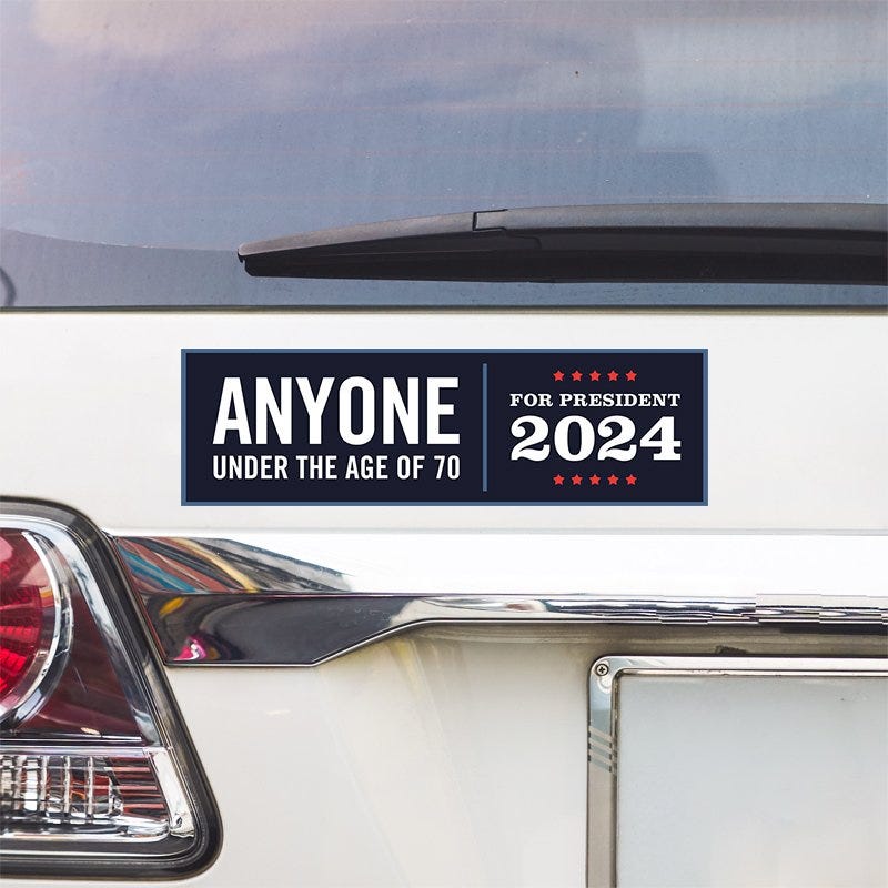 Anyone Under 70 bumper sticker above a white car's tail light