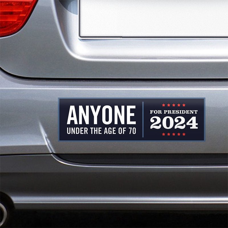 Anyone Under 70 bumper sticker on the bumper of a gray car