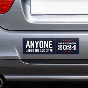 Anyone Under 70 bumper sticker on the bumper of a gray car