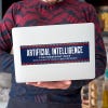 Artificial Intelligence Bumper Sticker on a laptop
