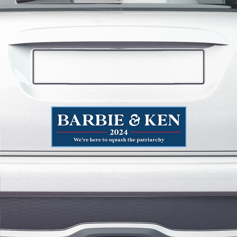 Barbie and Ken bumper sticker on the bumper of a white car