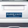 Barbie and Ken bumper sticker on the bumper of a white car